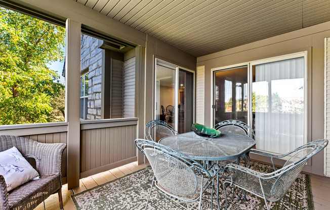 A patio with a table and chairs is shown.
