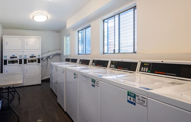 the laundry room is equipped with washers and dryers