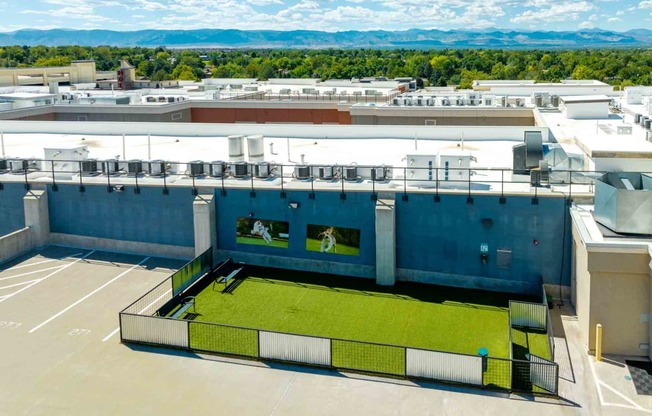 a tennis court on the roof of a building