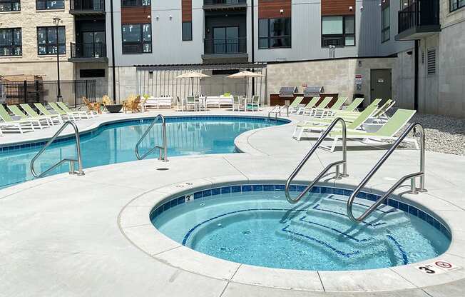 Circular spa hot tub near then outdoor resort style pool  at Haven at Uptown.