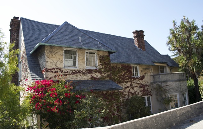 Fantastic Views with vine covered grand Tudor style home with slate roof.