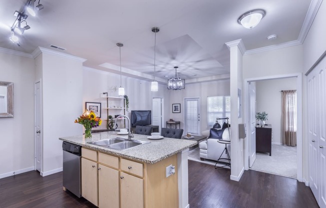 a kitchen with an island and a living room with a couch