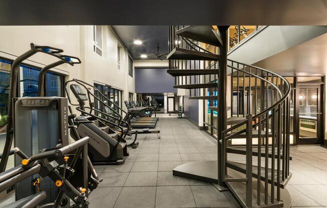 The two-story fitness center at Modera Beaverton offers ample space and premium equipment for every workout style.