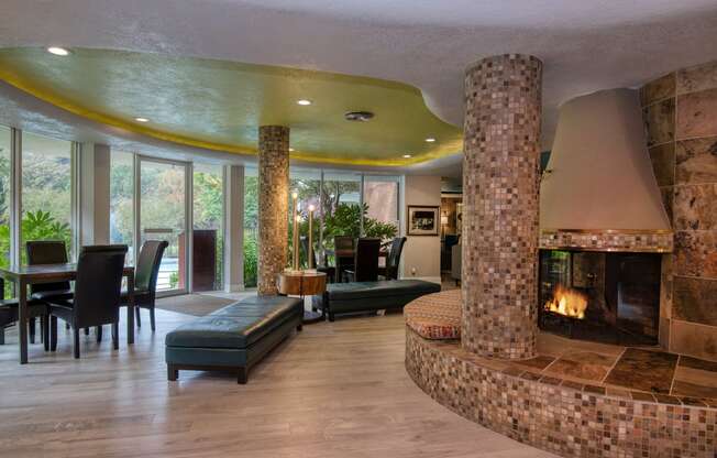 a living room filled with furniture and a large fireplace