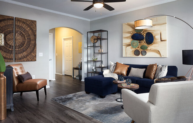 City Place at Westport Modern Living Room with Hardwood Style Floors, Ceiling Fan, and Arched Entry Way
