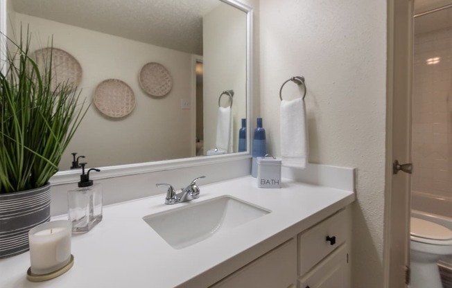 This is a photo of the bathroom in a 692 square foot 1 bed, 1 bath model aprtment at Cambridge Court Apartments in Dallas Texas