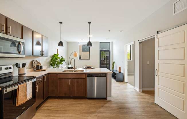 a large kitchen with wooden cabinets and a white counter top at EagleRidge Plaza Residences, Fargo, North Dakota