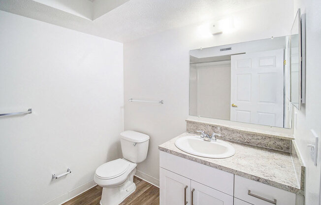 an upgraded bathroom with hard surface flooring at Black Sand Apartment Homes in Lincoln, NE