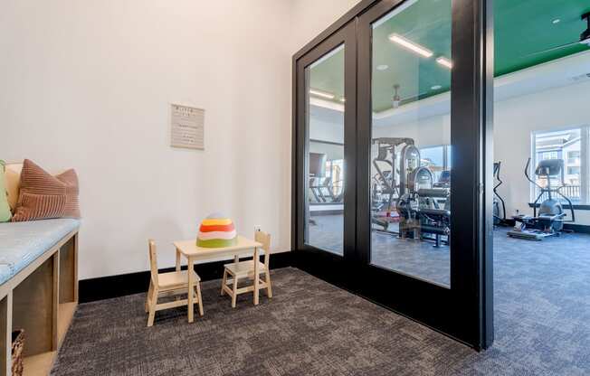 A room with a table and chairs in it.