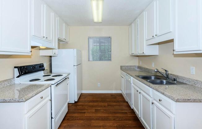 a kitchen with a white stove top oven