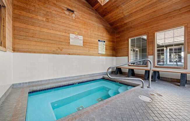 An indoor spa with a bench and a window at Clackamas Trails Apartments, Oregon, 97222