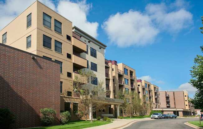 Apartment buildings with a clear blue sky above them.