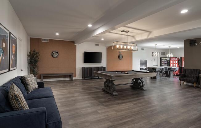 a living room filled with furniture and a large window