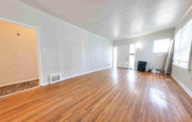 Very nice single family home with refinished hardwood and a very large open living room.