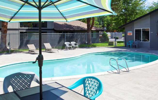 Maple Ridge Apartments Pool with Lounge Chairs