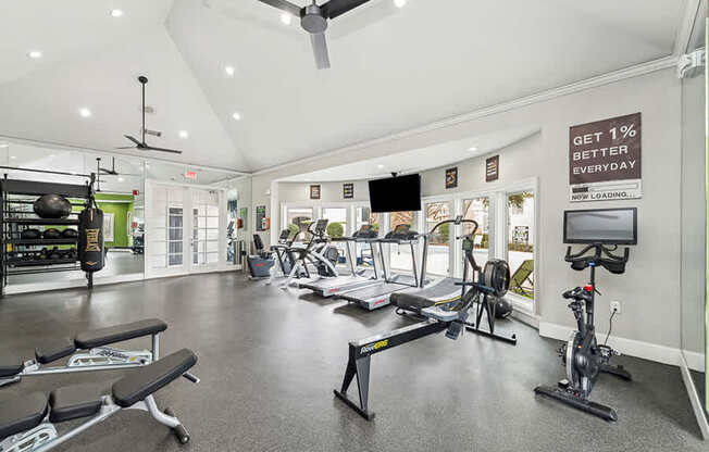 Community Fitness Center with Equipment at Bridges at Oakbend Apartments located in Lewisville, TX.