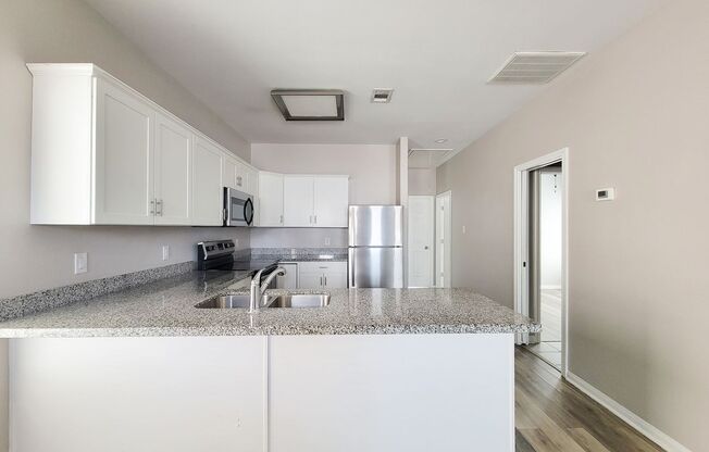 Beautiful 1 Story MOVE IN READY New Construction home in Lake Conroe Village Subdivision. This Gorgeous Open Floor Plan has 2 Bedrooms, 2 Baths. Front door with Glass Insert. Large Kitchen area with Granite counter tops and ample Kitchen Cabinets with S/S
