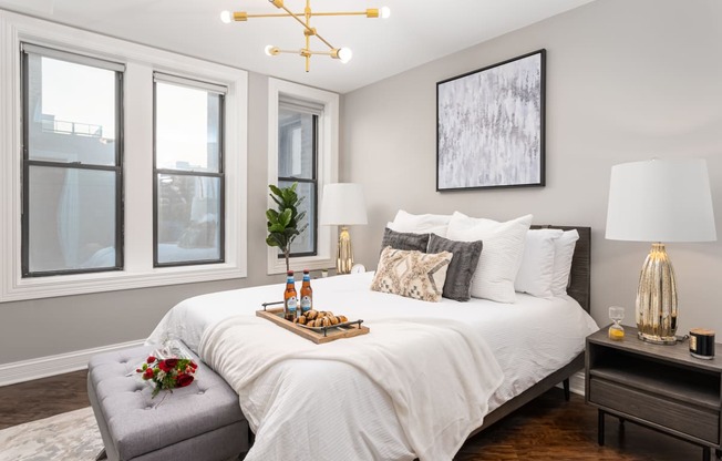 a bedroom with a large bed and a window