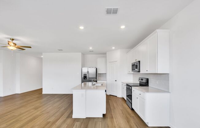 This single-story home has a smart layout that is perfect for growing families.