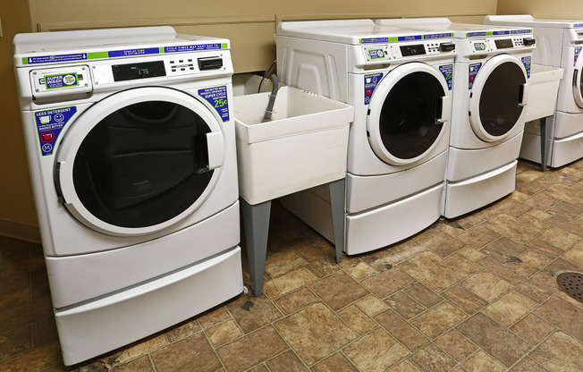 a row of washing machines in a laundromat