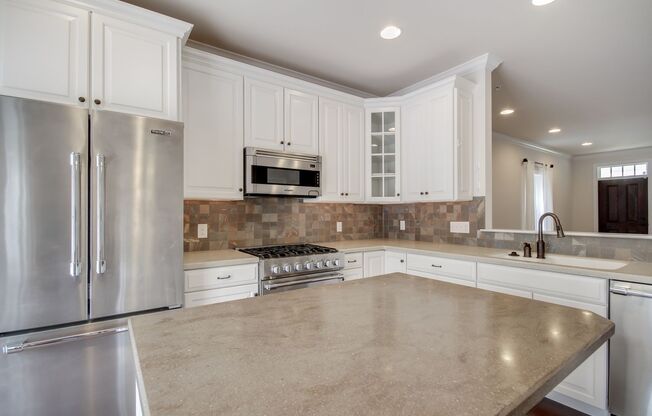 Luxury townhouse with a single-family feel in popular Haverford Court.