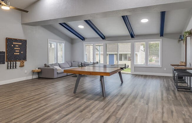 a living room with a ping pong table and a couch  at Kirkwood Meadows, Pocatello