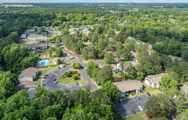 an aerial view of a neighborhood with houses and trees