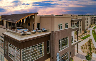 Outdoor rooftop lounge with plush furniture at Encore at Boulevard One, Denver, 80230