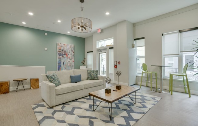a living room filled with furniture and a large window