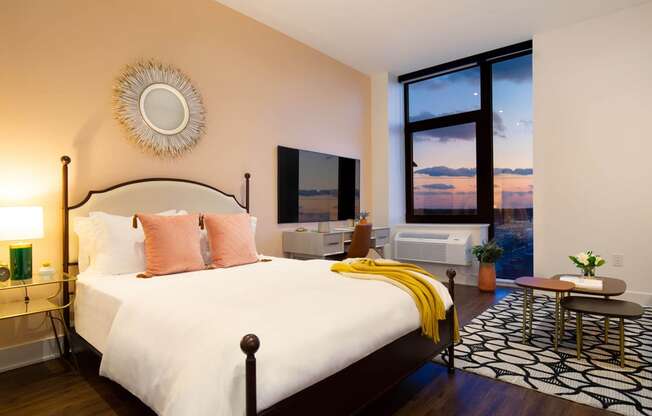 a bedroom with a bed and a large window at The Irvine, Pennsylvania