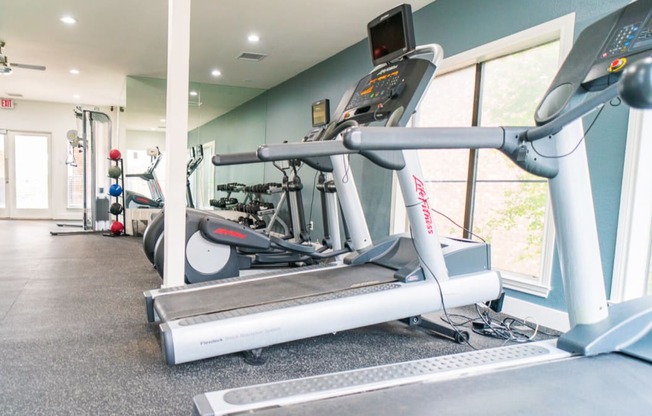 the gym is equipped with treadmills and other exercise equipment