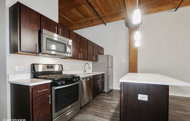 Breathtaking kitchen space with a floating islandat Carriage House Lofts, Chicago, IL, 60605