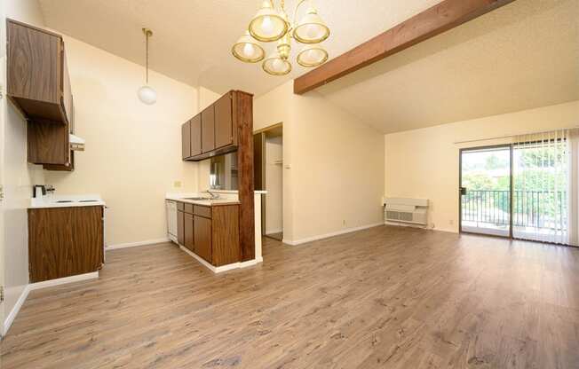 a kitchen and living room in a 555 waverly unit at Park Columbia Apts, Hemet, CA