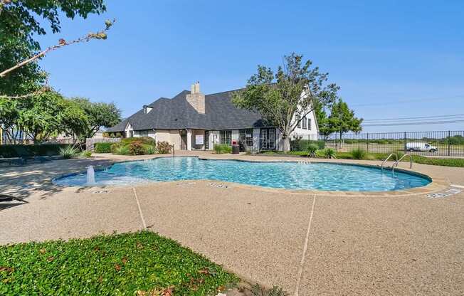 A house with a pool in the backyard.