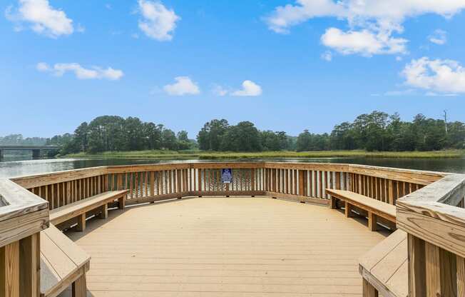 a circular deck with benches overlooking a lake at Linkhorn Bay Apartments, Virginia Beach, Virginia