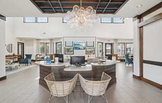 A reception area with a desk and two chairs.