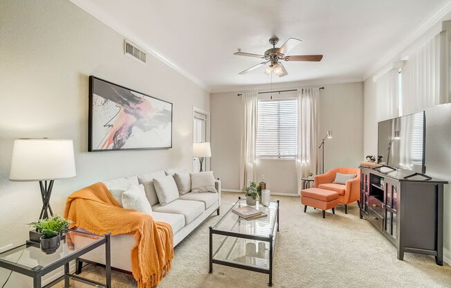a living room with a white couch and a ceiling fan at Adiamo Palm Valley, Arizona