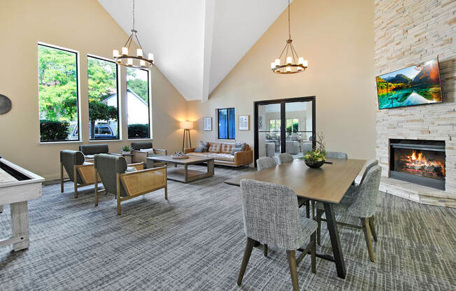 cloubhouse with a table and chairs and a fireplace