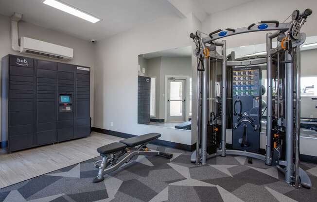 A gym with a row of exercise machines.