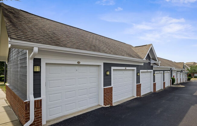 a row of garages in a row with a blue sky in the background