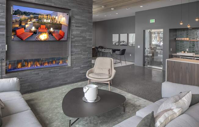 Northpointe Apartments Clubhouse Seating Area by Indoor Fireplace