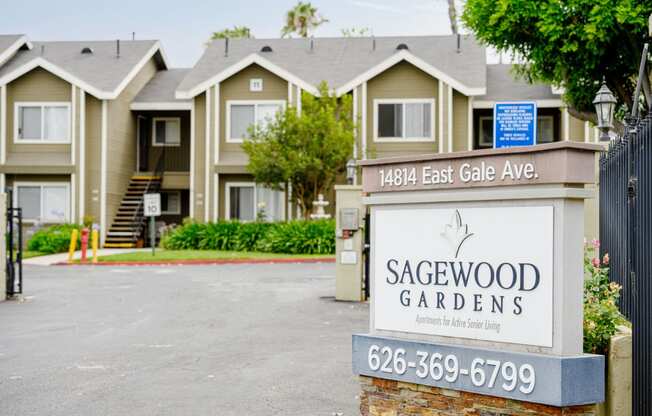 a sign in front of a row of houses at Sagewood Gardens Senior Apartments, Hacienda Heights, 91745