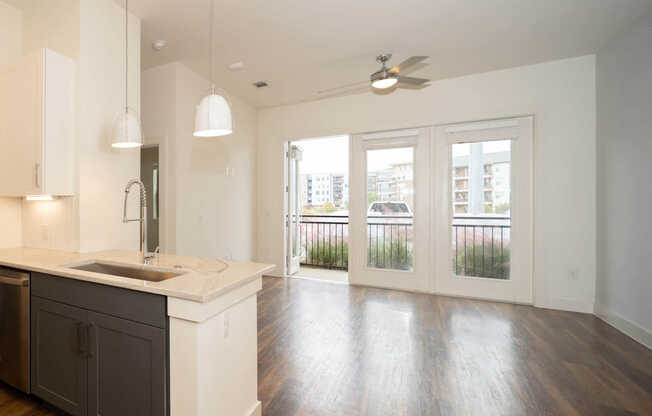 Living Room with Balcony and Hard Surface Flooring