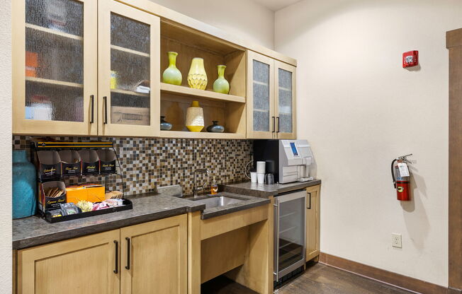 a kitchen with a sink and cabinets and a fire hydrant at Lakeline East Apartments, Texas, 78613