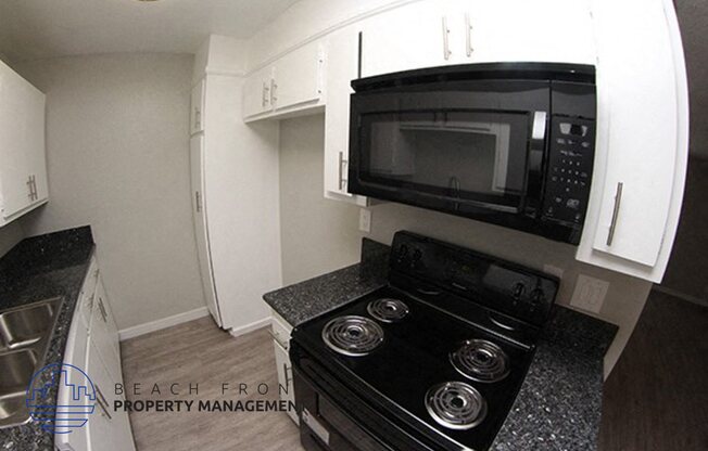 a kitchen with a stove and a microwave