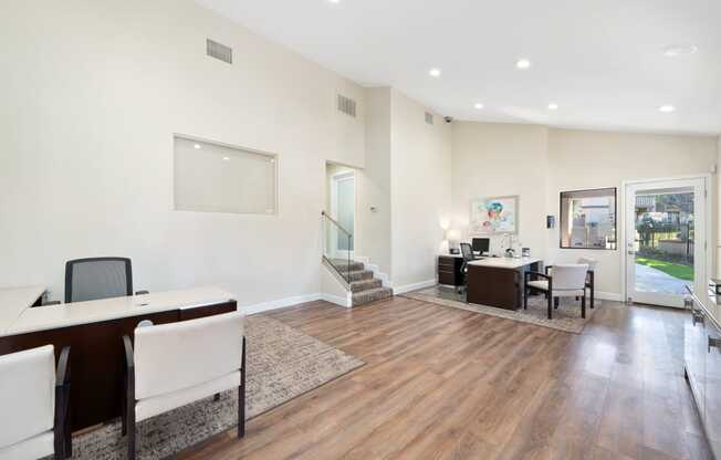 a room with hardwood floors and white walls
