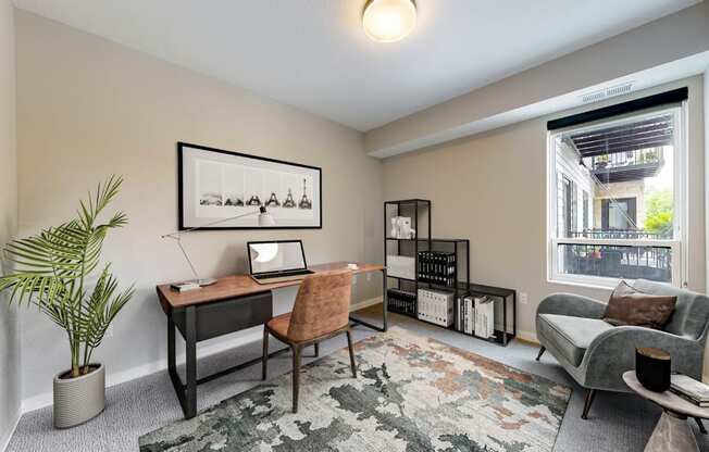 a home office with a desk and a window