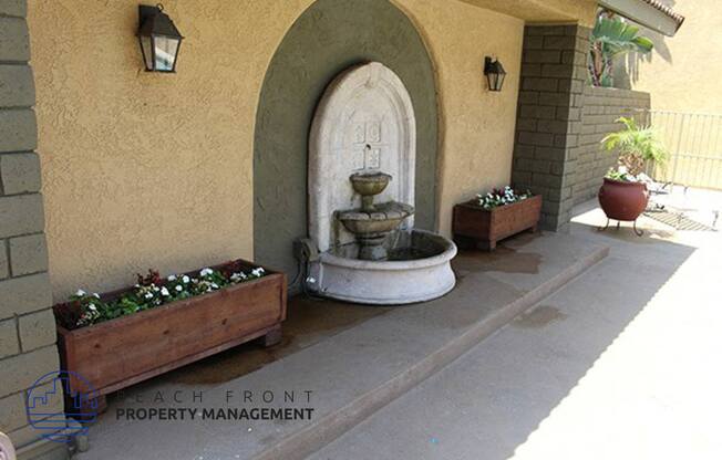 a fountain in the courtyard of a building