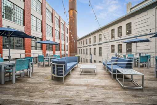 A patio area with tables and chairs is shown.