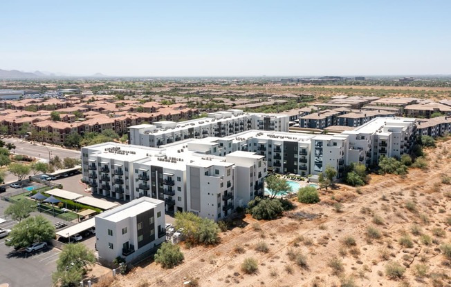 an aerial view of slate scottsdale large apartment complex in the middle of a desert